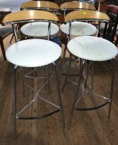 A set of four 1970s beechwood and chrome-framed kitchen bar stools, with white seats.