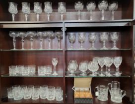 Set of six and part sets of cut-glass wine glass, brandy glasses, tumblers, two tankards, and a jug.