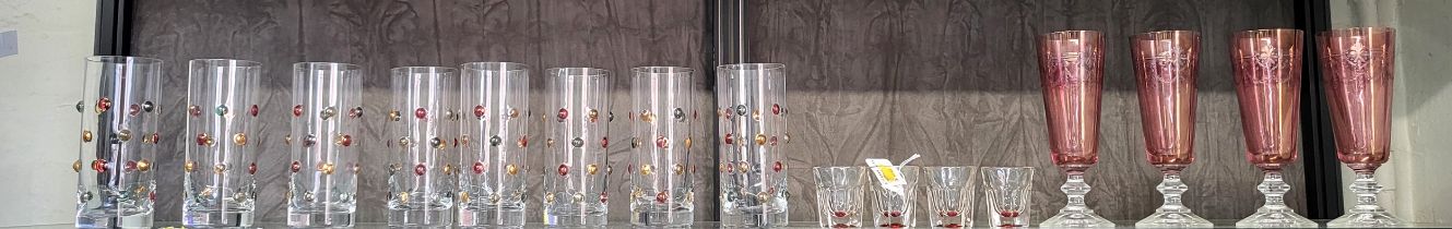 A set of eight Krosno raised-dot glasses, four rose tinted shot glasses, and four wine glasses