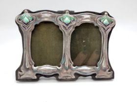 An Arts and Crafts style silver and enamel easel-back picture frame, with turquoise enamelling.