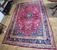 A Persian Mashad floor rug, traditional floral medallion design, polychrome decorated, multi-