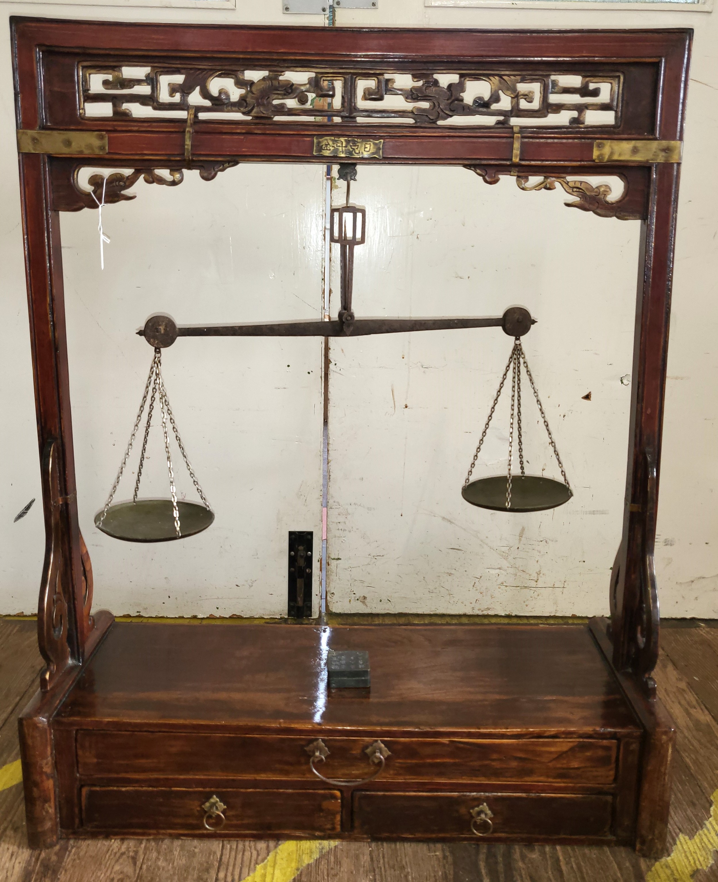 A set of Chinese apothecary weighing scales, the hardwood stand with brass weighing scales. 95cm x