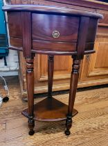 A modern mahogany corner unit, having single drawer, and turned legs, with plant stand beneath. 79cm