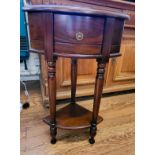 A modern mahogany corner unit, having single drawer, and turned legs, with plant stand beneath. 79cm