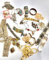 A group of various white metal jewellery pieces, including bracelets, mother-of-pearl, white metal