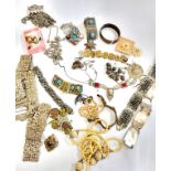 A group of various white metal jewellery pieces, including bracelets, mother-of-pearl, white metal