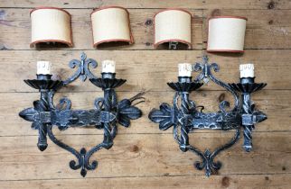 Four matching metal wall sconces (Medieval Italian castle style), 45cm high, 40cm width.