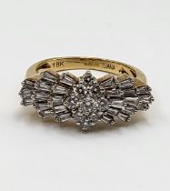 An 18ct yellow gold and diamond ring, centred with a kite shaped cluster of round brilliant-cut