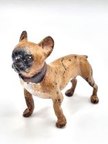 A cold painted bronze figure of a dog. 5cm h x 5.5cm w