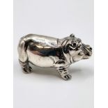 A novelty silver figure of a hippo. 2cm x 4cm.