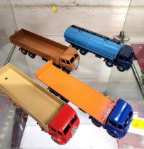 Four Dinky Toys Foden 1st type Lorries including two-tone blue Petrol Tanker, all repainted. (4)