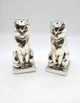 A pair of white metal Art Deco style condiments in the form of a pair of Egyptian cats, stamped 800.