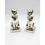 A pair of white metal Art Deco style condiments in the form of a pair of Egyptian cats, stamped 800.