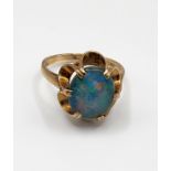 A 9ct yellow gold and triplet opal ring, set with an oval triplet within six claw setting, size O.