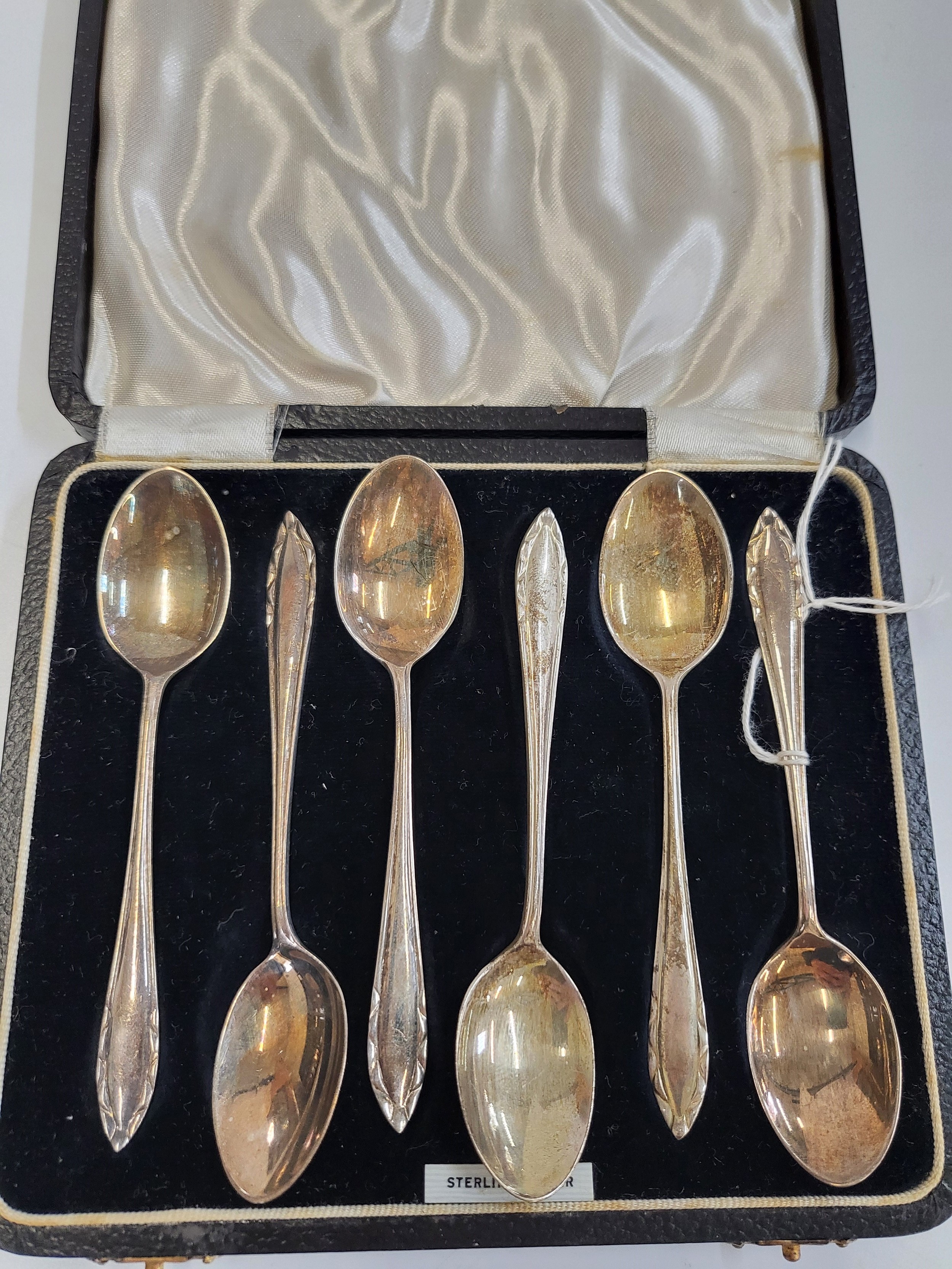 A set of six silver teaspoons, cased.