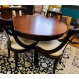 A circular extendable reproduction table and four chairs, table is 112cm with a single center