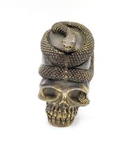 A novelty brass skull vesta case, with a coiled snake. 5.2cm