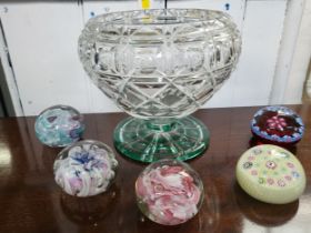 A cut-glass bowl with viridian tinted foot, 20cm high by 23cm diameter, and two millefiore and three