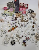 A box of costume jewellery, to include various silver and white metal rings, beaded necklaces,