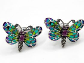 A pair of silver plique-a-jour style butterfly cufflinks.