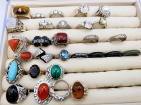 A group of twenty-three various silver rings, set with cubic zirconia, amber, moonstone, coral,