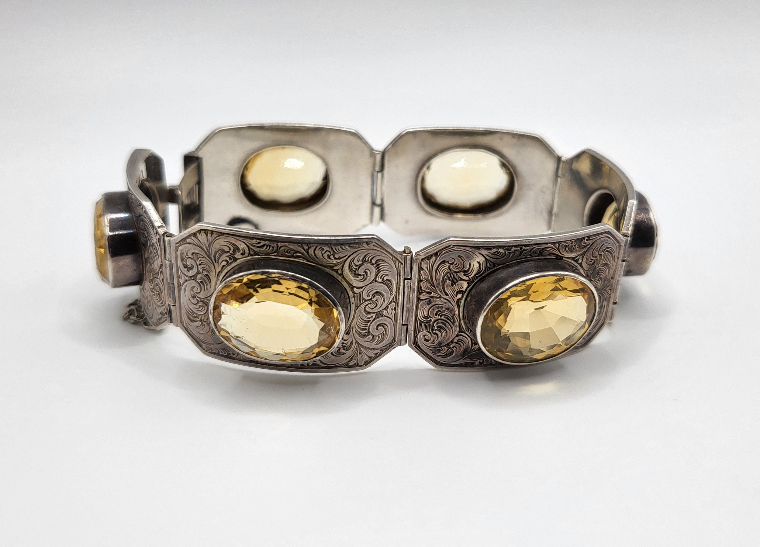 A Victorian silver segmented bracelet, set with six mixed oval-cut citrines, the silver with