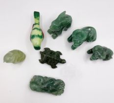 A group of nephrite and jade animals, including two oxen, a jadeite rabbit, a nephrite turtle, a