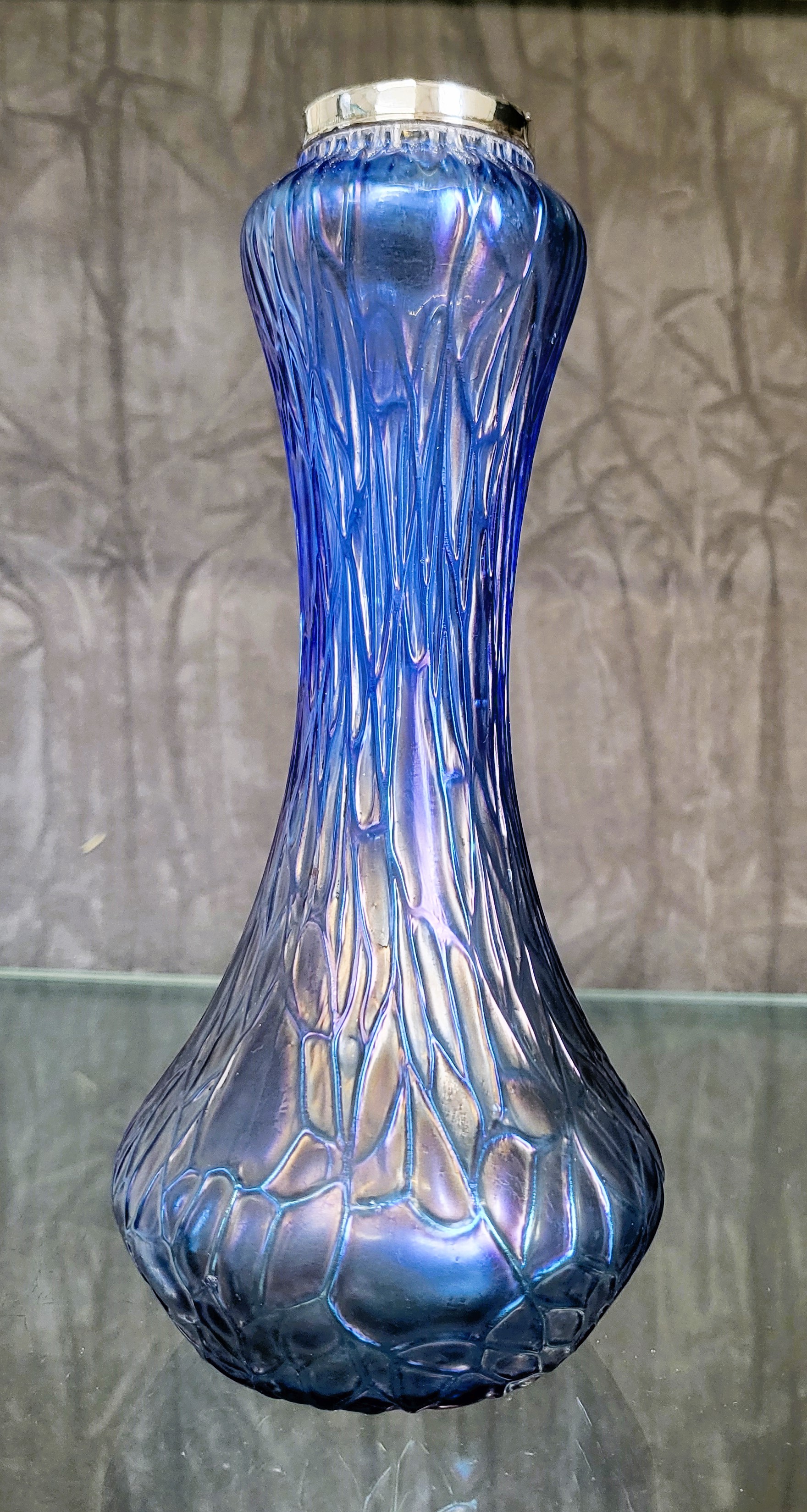 A 1920's Art Nouveau-style iridescent glass vase, 18.5cm with silver neck rim collar H.P. & S. (