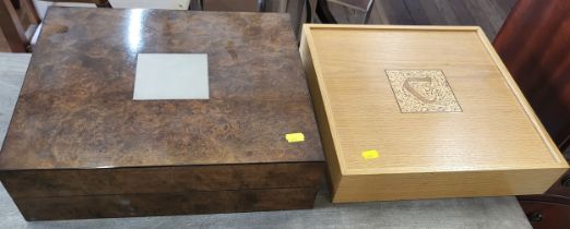 A collectables box in walnut and a blond oak box with a decorative inlayed lid. both 10 x 38 x 30