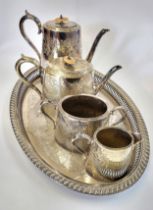 A collection of silver-plate including a tray, a coffee pot, a tea pot,a sugar bowl and cream