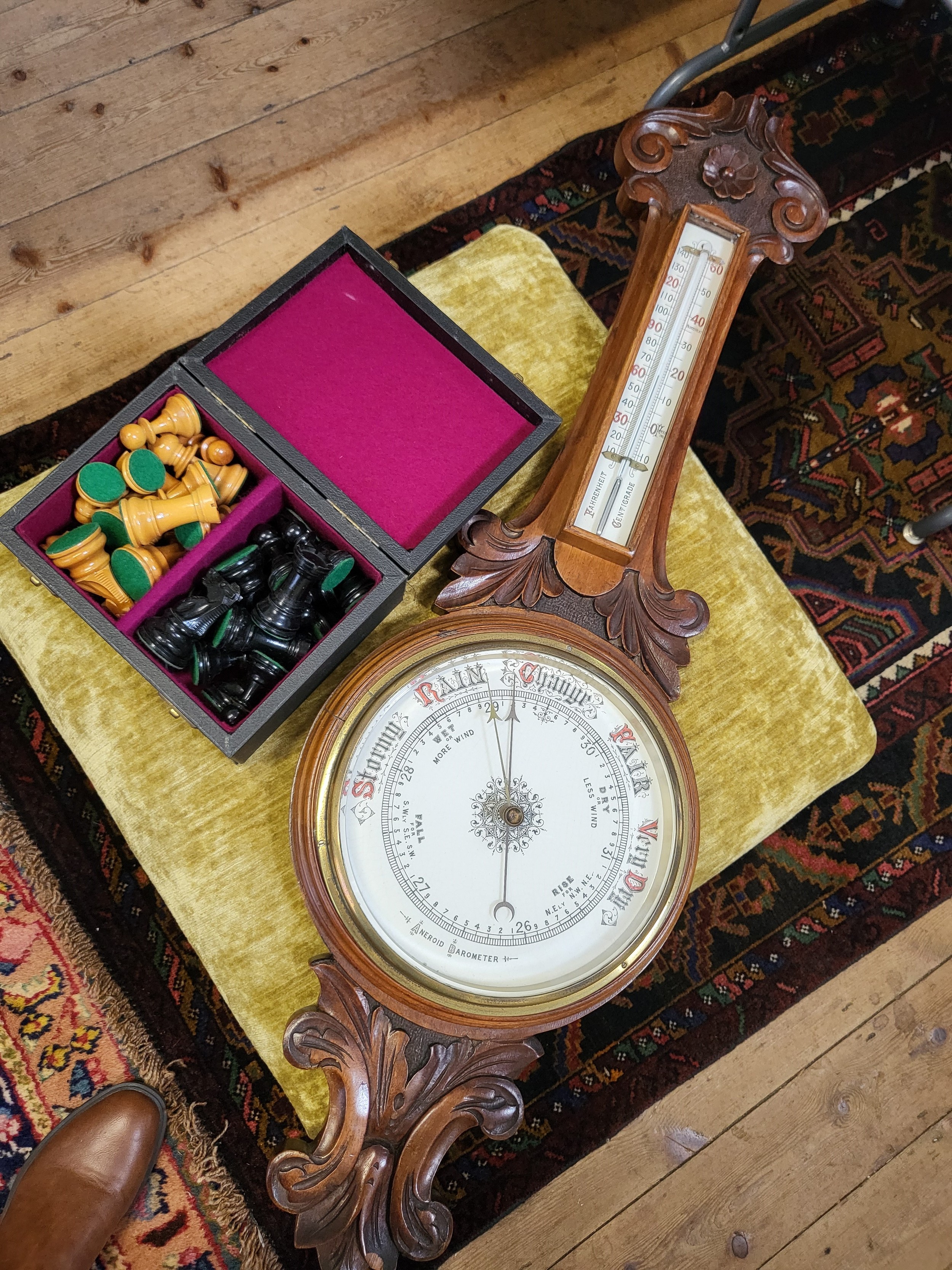 An Aneroid Barometer in a carved mahogany case, early 20th century. Also to include a modern