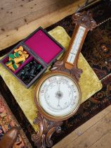 An Aneroid Barometer in a carved mahogany case, early 20th century. Also to include a modern