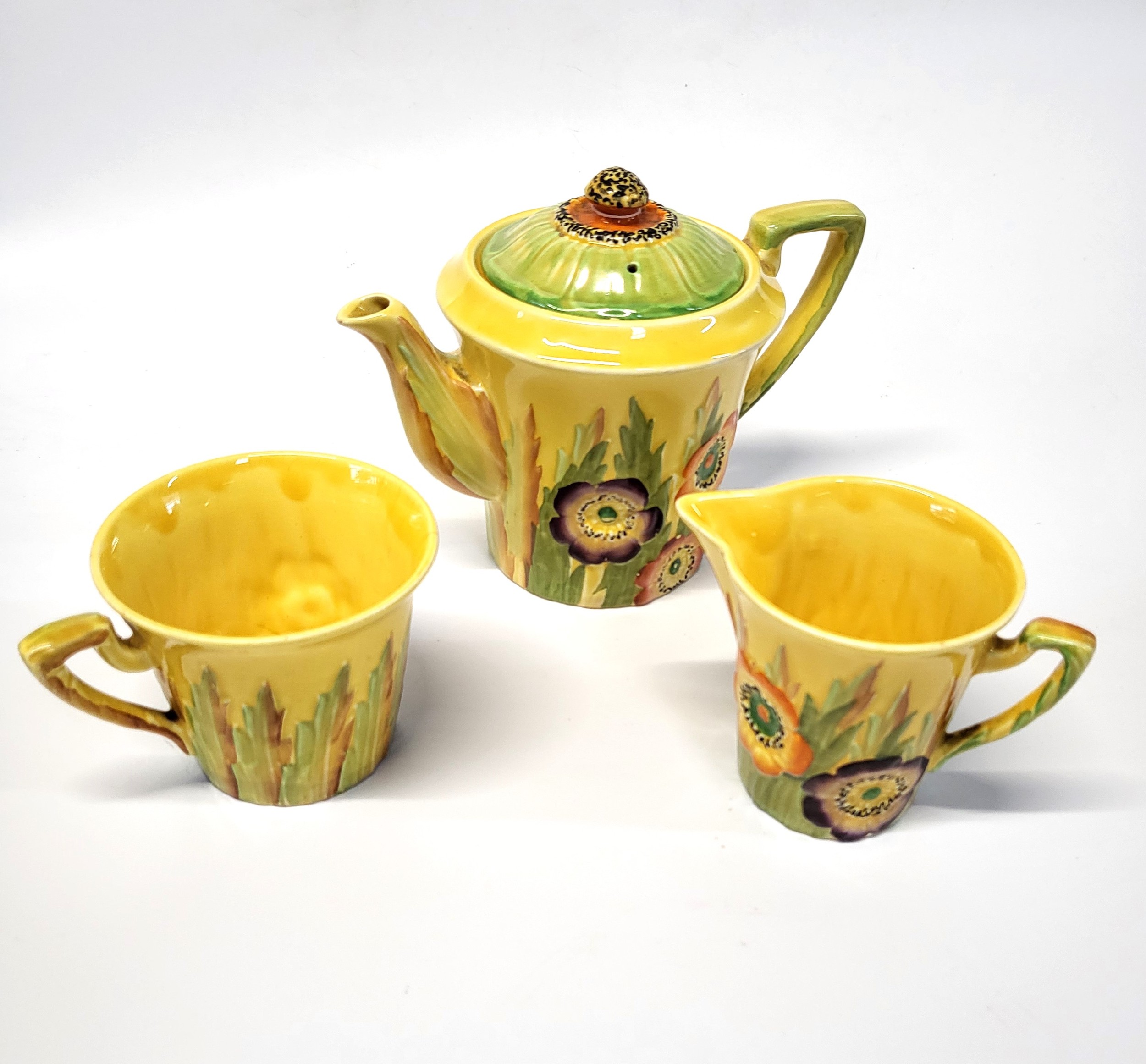 A Carlton Ware Australian Design tea-pot, cup and jug. (3)
