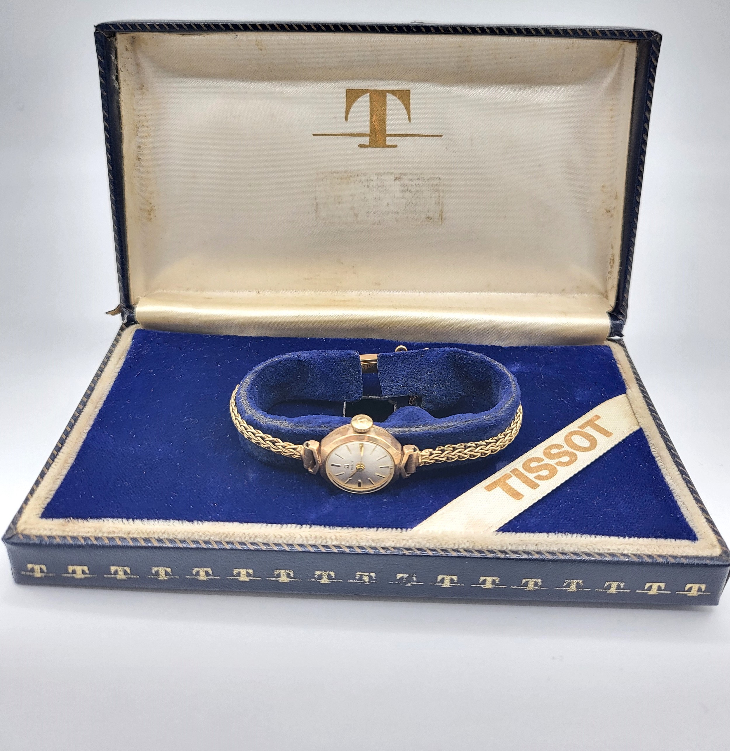 A Tissot 9ct gold ladies watch on an articulated bracelet and safety chain in the original - Image 2 of 2