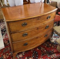 A mahogany bow-front chest of three drawers, brass handles, supported on bracket feet. 85cm x 94cm x