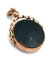 A rose gold and carnelian and onyx swivel fob, with chain-link mount, the mount hallmarked Chester