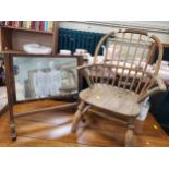 A mahogany dressing table mirror on a stand, the stand with brass finials and fluted column