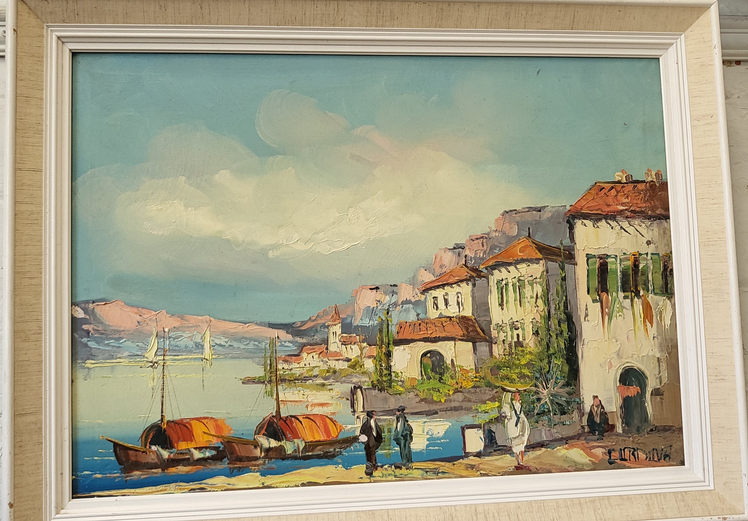 A mid century oil on canvas depicting a waters edge scene. indistinctly signed. 61 x 81 cm. Framed