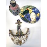 A Faience anchor-shaped wall pocket, 35cm, an art pottery bowl depicting two Parakeets and girl with