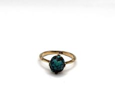 A 9ct yellow gold and turquoise ring, set with an oval cabochon turquoise matrix, size P 1/2, 2.5