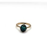 A 9ct yellow gold and turquoise ring, set with an oval cabochon turquoise matrix, size P 1/2, 2.5