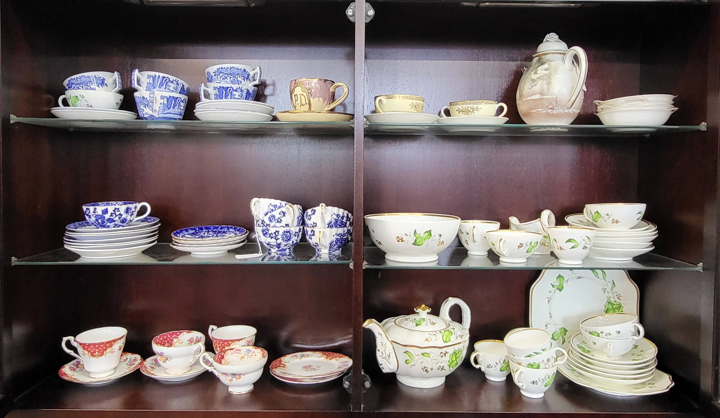 Porcelain cups and saucers including Spode and Paragon, a tea set and a Japanese coffee pot. (75)