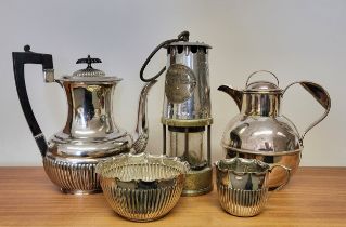 A collection of silver plate items including a teapot and a water jug
