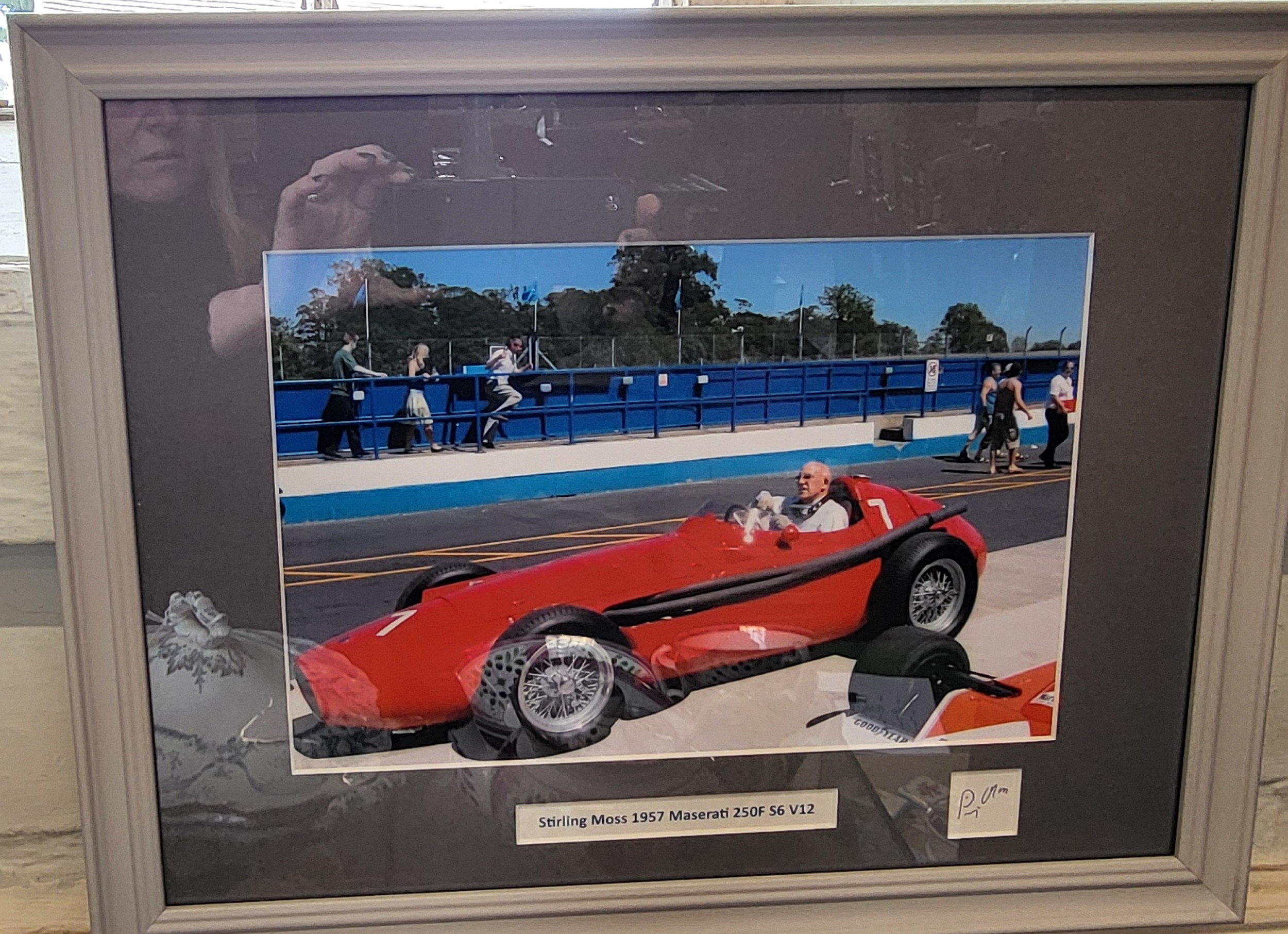 Sir Stirling Moss framed photo 1957 Maserati 250F V6 with signature. 34cm x 44cm.