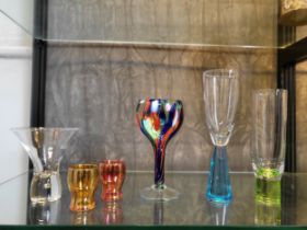 A wine glass with red, white, blue and pale green mottling 17cm, one pink and one orange lustre