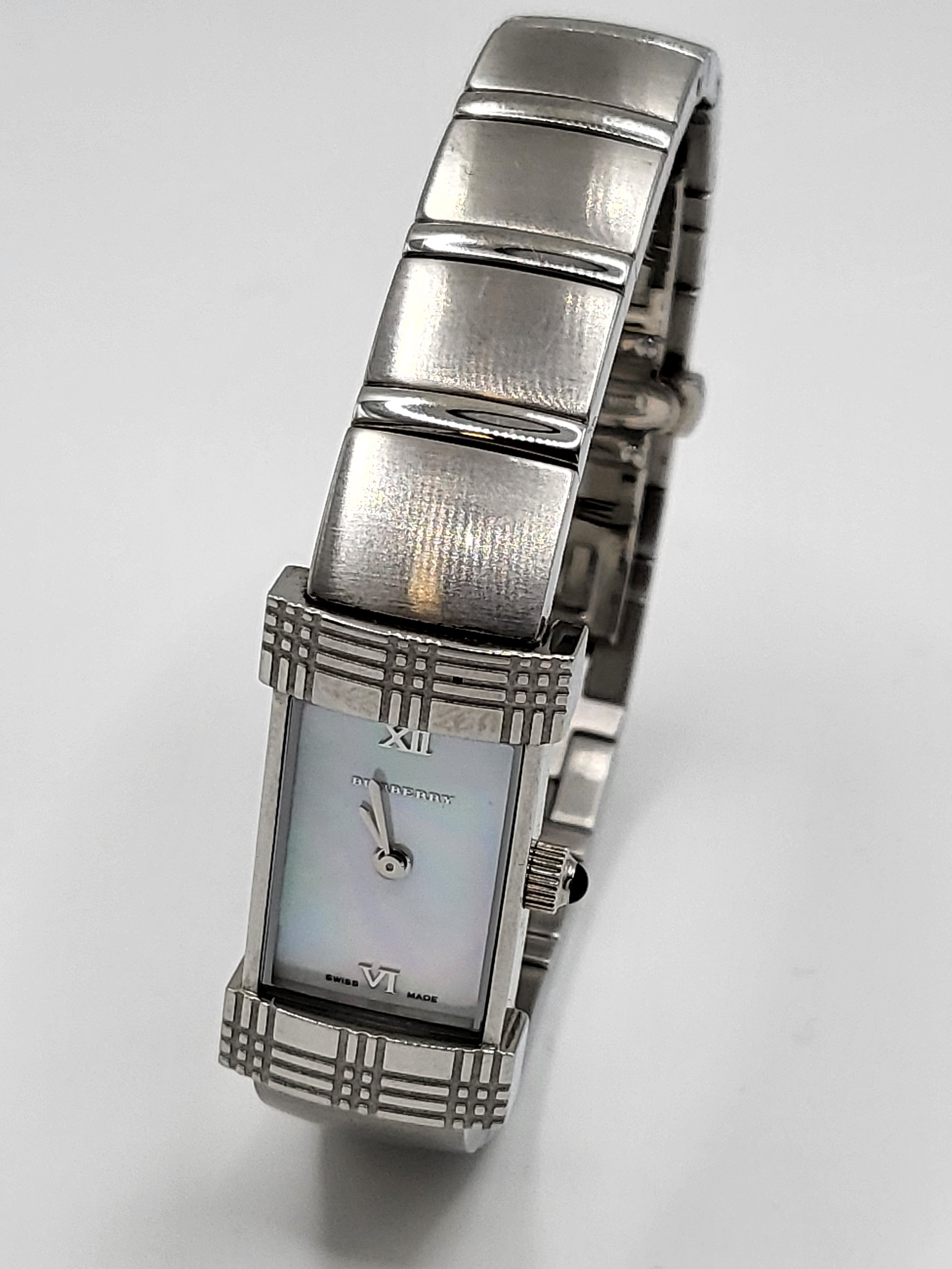 A Ladies Burberry watch with a Mother of Pearl Dial and a Quartz movement.
