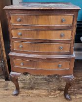 A small bow front chest of drawers, supported on cabriole legs. 78cm x 47cm x 34cm.