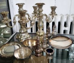 A large group of silver plated cutlery and various other plated items, including spoons, forks,