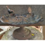 A cast iron bird bath measuring 17cm x 36cm x 26cm.