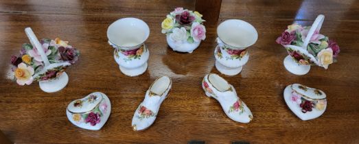 A Royal Doulton Roses encrusted posy and eight Royal Albert Old Country Roses pattern miniatures